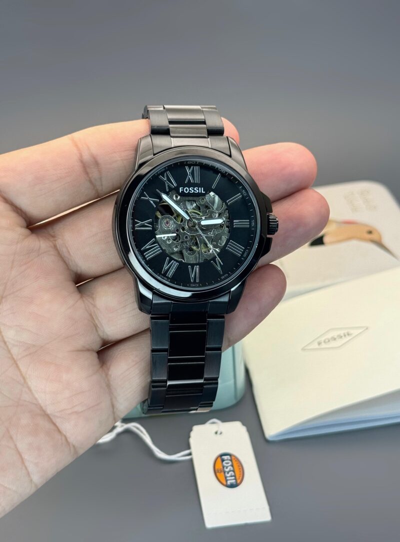 Fossil First Copy Modern Machine watch – black case, automatic movement.