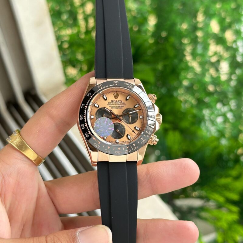 Showcasing Rolex Daytona Oysterflex Rose Gold First Copy Watch man holding watch in hand