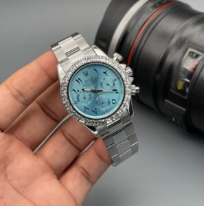 Rolex Daytona Iceblue Arabic Dial First Copy Watch on a man hand with a watch box in the background