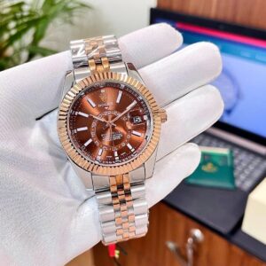 Man wearing white golves showcasing Rolex Sky-Dweller 38 Brown Dial First Copy Watch