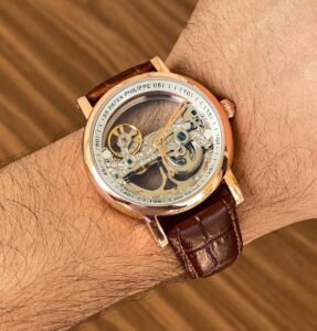 Patek Philippe Full Transparent first copy men’s watch – rose gold case, leather strap, open back automatic.