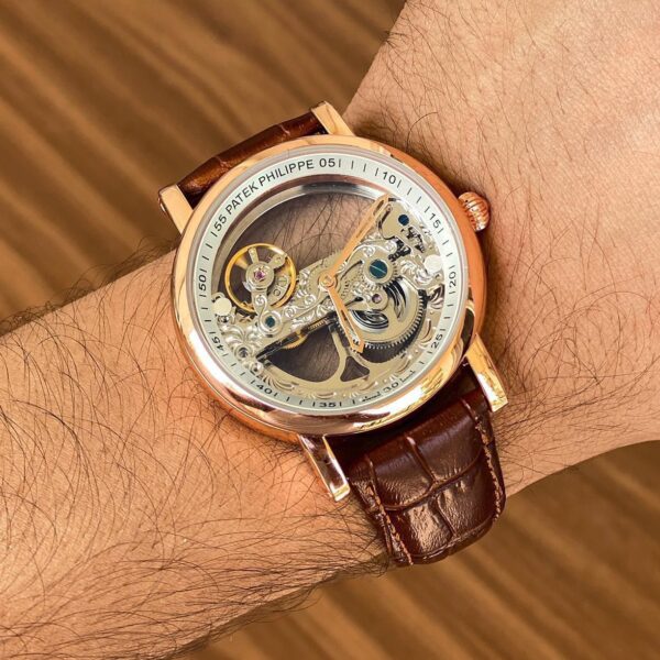 Patek Philippe Full Transparent first copy men’s watch – rose gold case, leather strap, open back automatic.